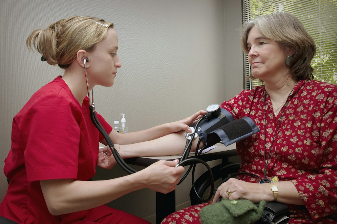 Clinician measuring a patient’s blood pressure during a cardiovascular checkup